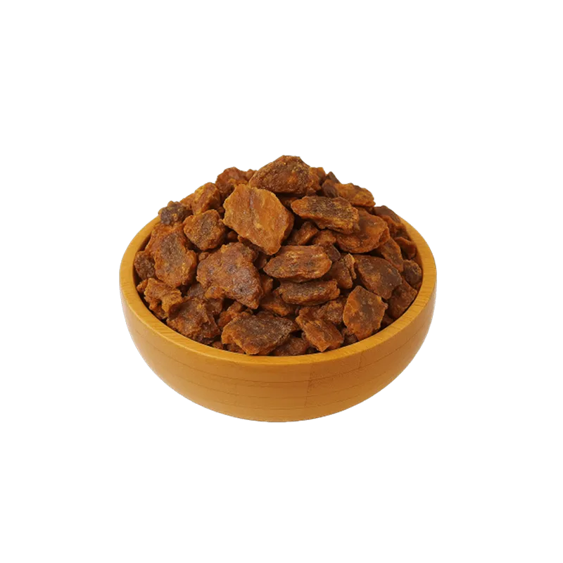 عکس تکه هایی از بره موم عسل در کاسه چوبی