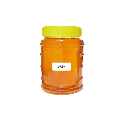 عکس یک شیشه عسل کنار با یک برچب روی آن