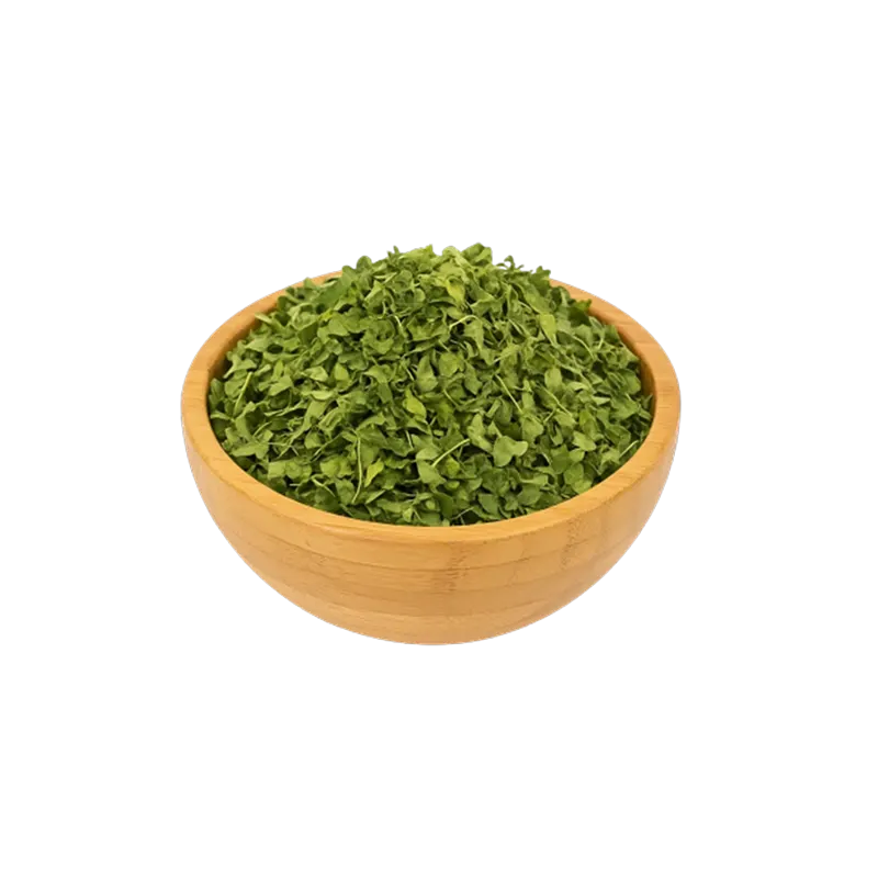 عکس مقداری گیاه مورینگا در کاسه چوبی